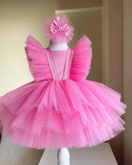 Front view of a pink tulle tiered flower dress for girls, showcasing soft layers and delicate floral details.