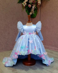Front close view of the embellished high-low dress with a sweep train for girls.