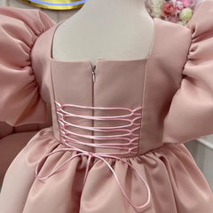 Close-up of the puffy sleeve detail on a pink princess dress, showing intricate craftsmanship and luxurious fabric.