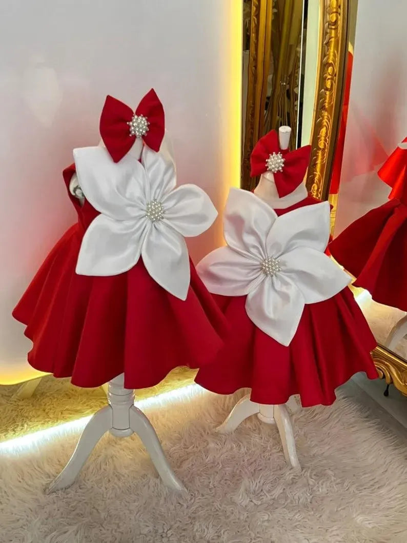 Front view of Holiday Floral Bow Dress with Pearls – red satin holiday dress for girls