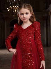 Close-up of red sequin bodycon dress with intricate sequin details and soft tulle texture.