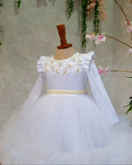 Side view of white dress with elegant butterfly embellishments for special occasions.