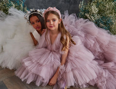 Close-up of layered tulle fabric and ruffle details on the Girls' Luxury Tulle Dress in blush pink.