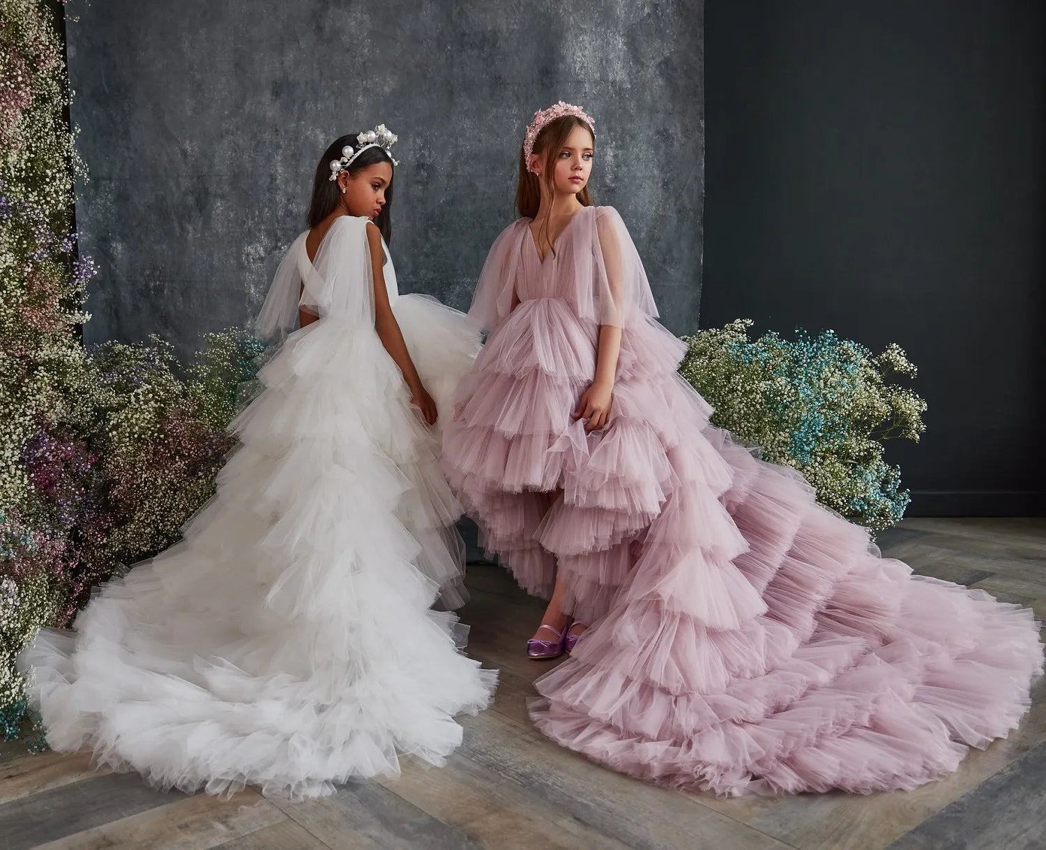 Landscape Front view of Ruffled Girls' Luxury Tulle Dress in blush pink and white, featuring ruffled layers and cascading design.